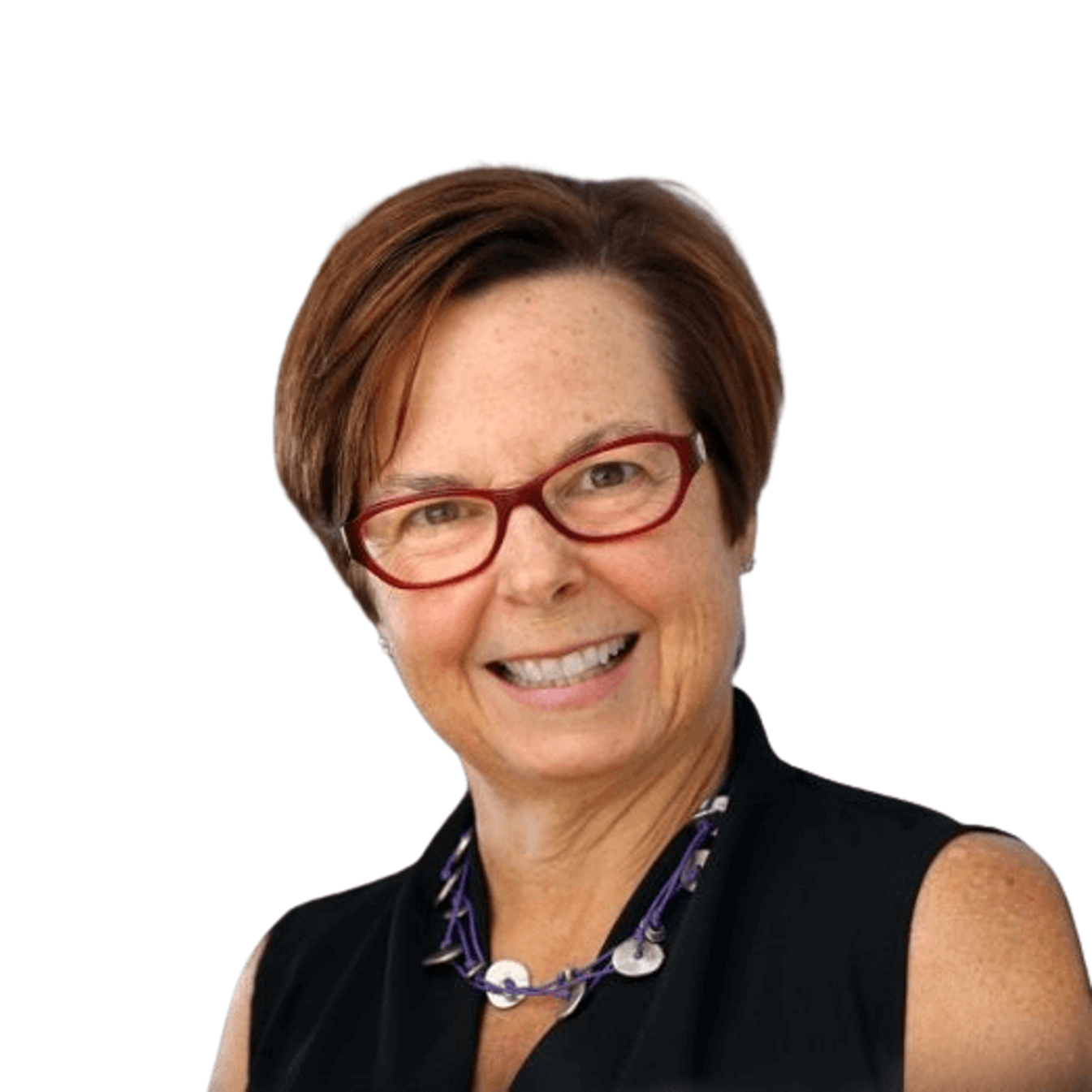 A woman wearing glasses and a black top smiles warmly at the camera.