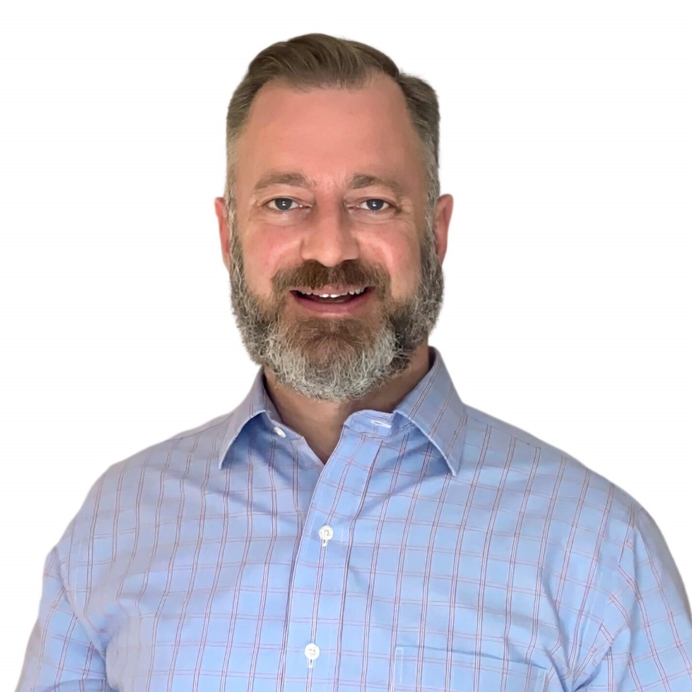 A man with a beard wearing a blue shirt.