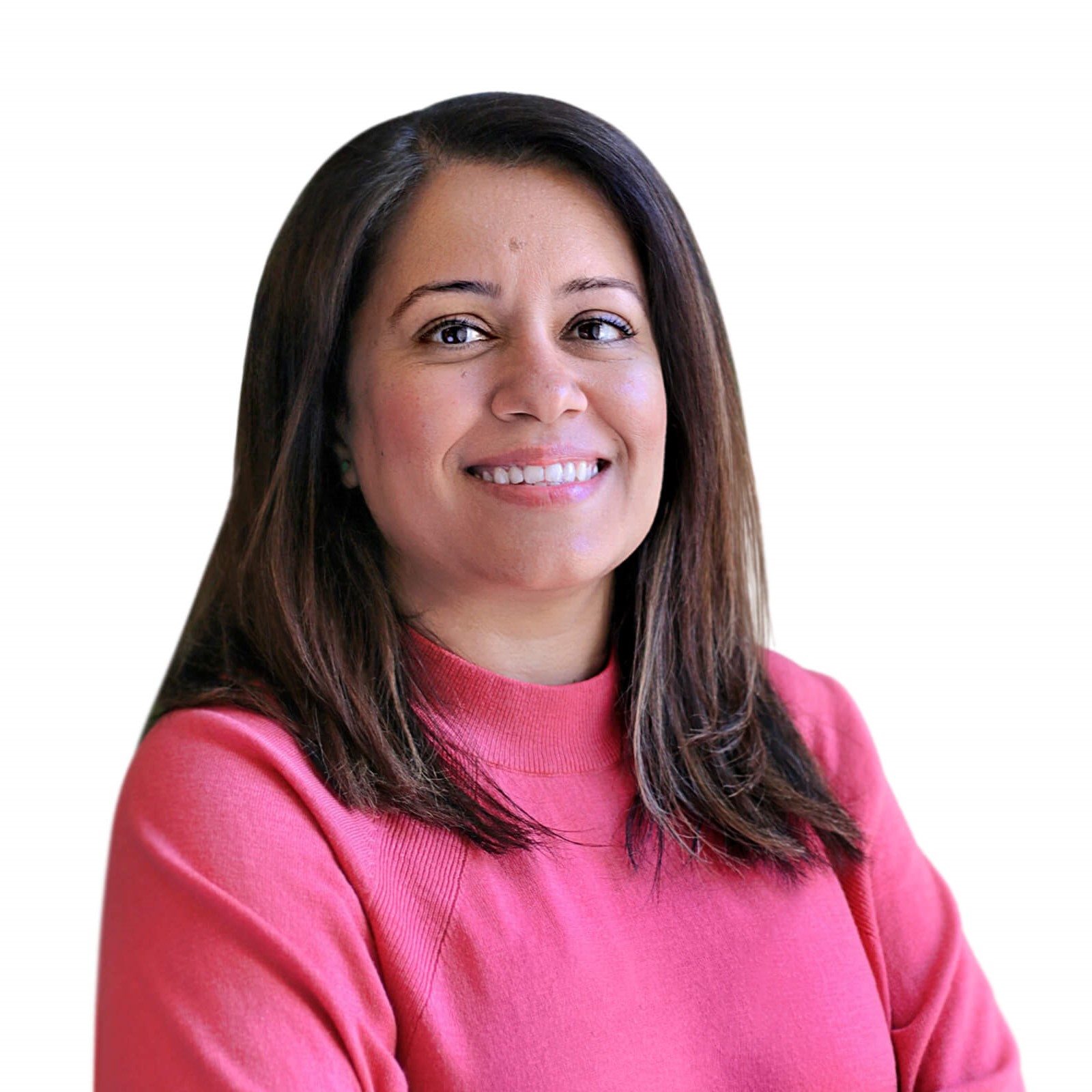 A woman wearing a pink shirt smiles warmly at the camera.